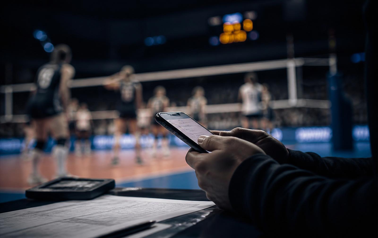 Scorekeeper updating live scores from the sideline